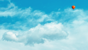 Air balloon in cloudy sky